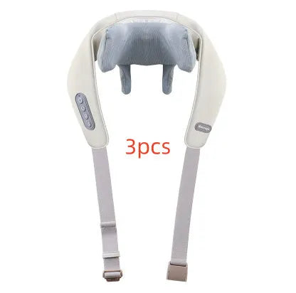 Beige neck massage pillow with six massage heads and wireless remote control on a table