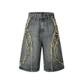 Distressed raw edge denim shorts in light blue on a mannequin, showing straight cut and cropped length.