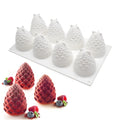 Set of six silicone baking moulds showing pineapple, pine cone, and pear shapes for desserts.