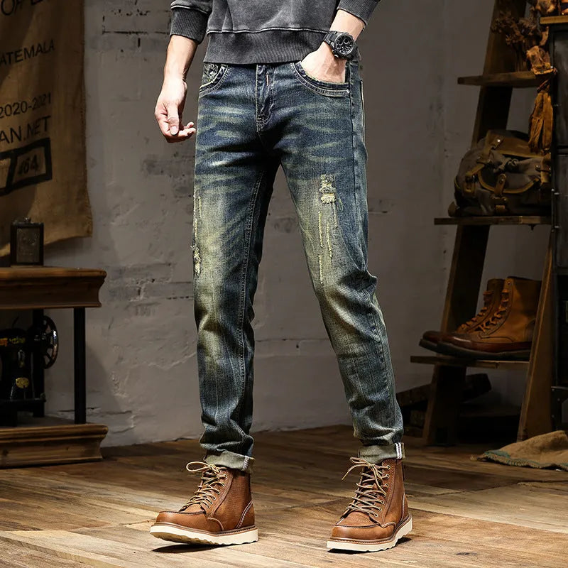 Men's skinny fit stretch denim jeans in a retro blue wash with a five-pocket design.