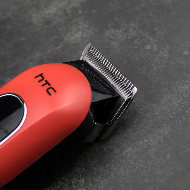 Professional digital electric hair clipper in black with four limiting combs and accessories for home grooming
