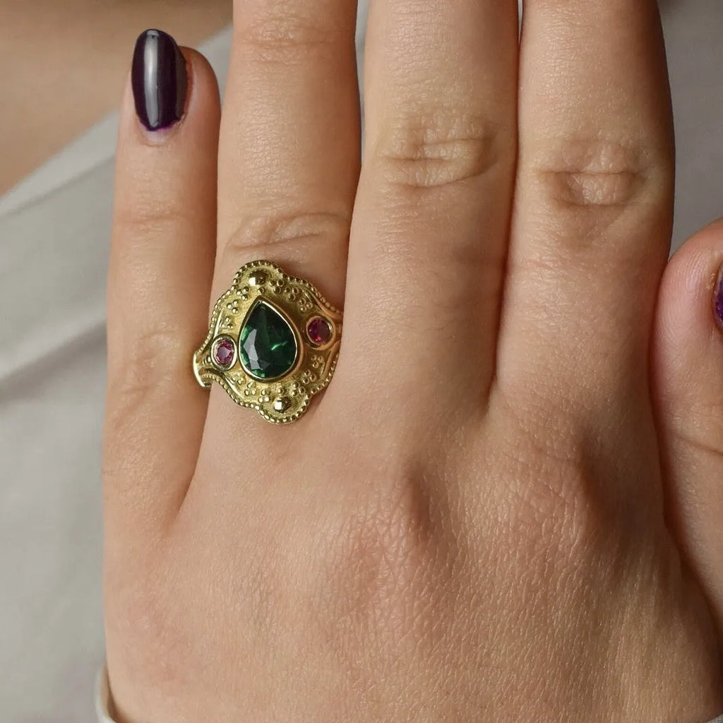 Women's golden Lvzuan geometric ring electroplated on alloy, shown on a hand