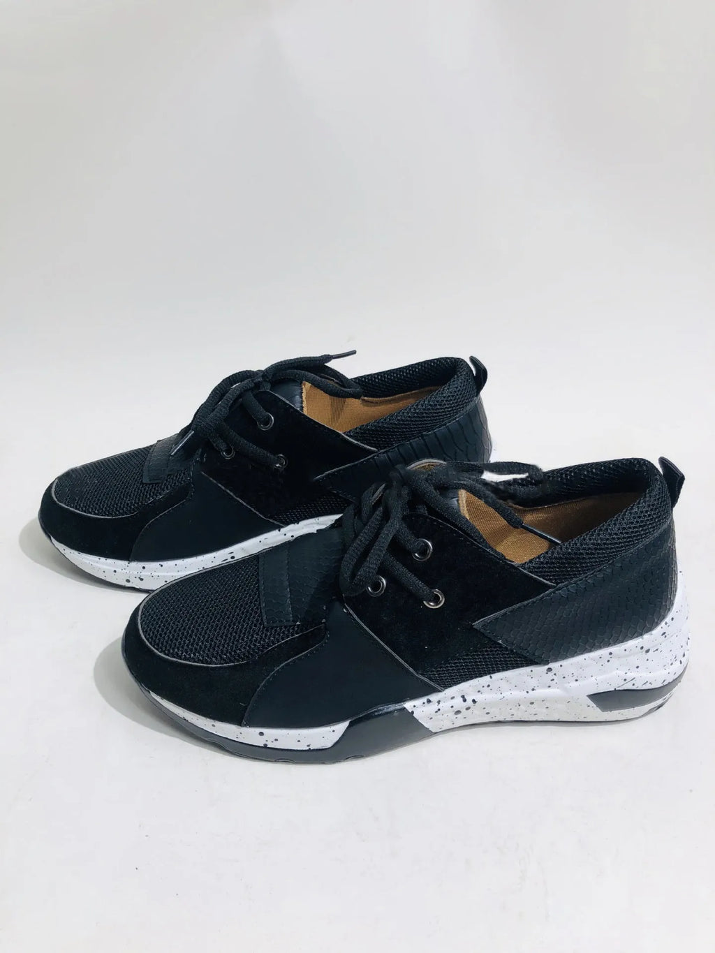 Women's casual suede wedge sneakers in leopard print with a low-cut design and plastic sole.