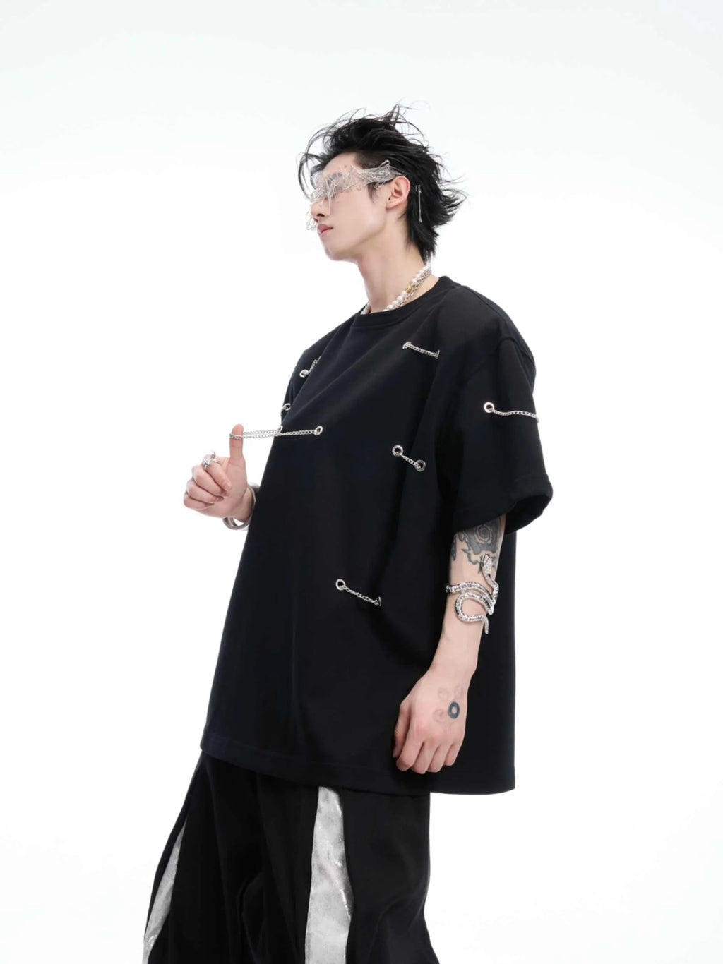 Black heavy cotton t-shirt with padded shoulder panels and silver metal chain decorative details