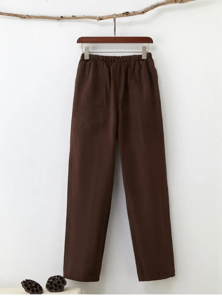 Men's beige pure cotton casual trousers with drawstring waist and belt on a neutral background.