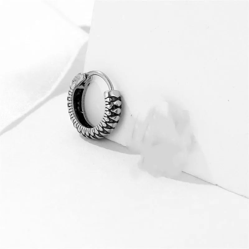 Geometric retro twist stainless steel earrings with circular sports style element in silver
