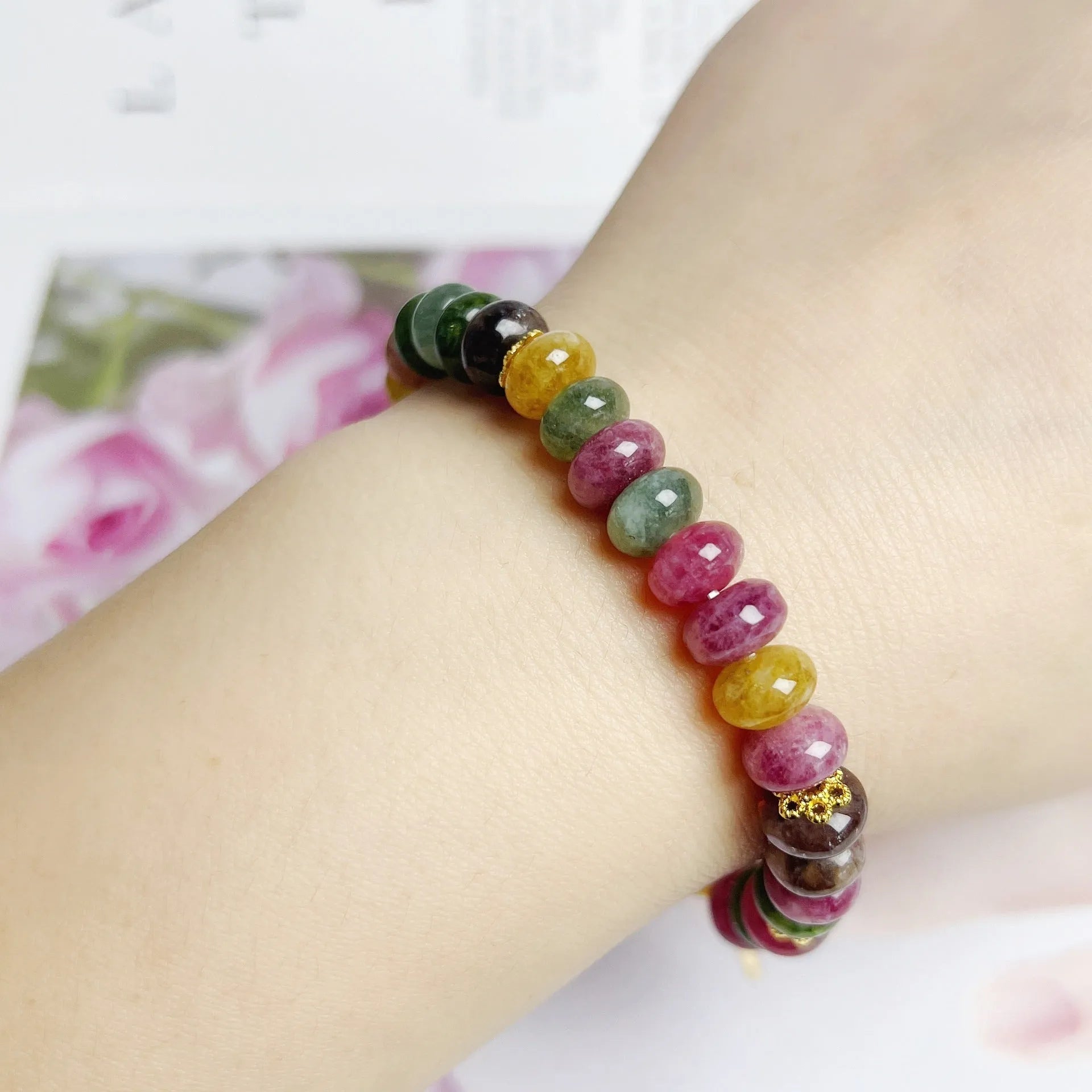 Colorful tourmaline abacus beads crystal stretch bracelet for women on a white background