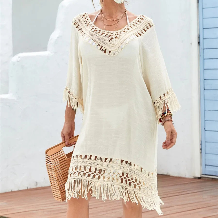 Women's apricot coloured crocheted patchwork dress with half sleeves on a model.