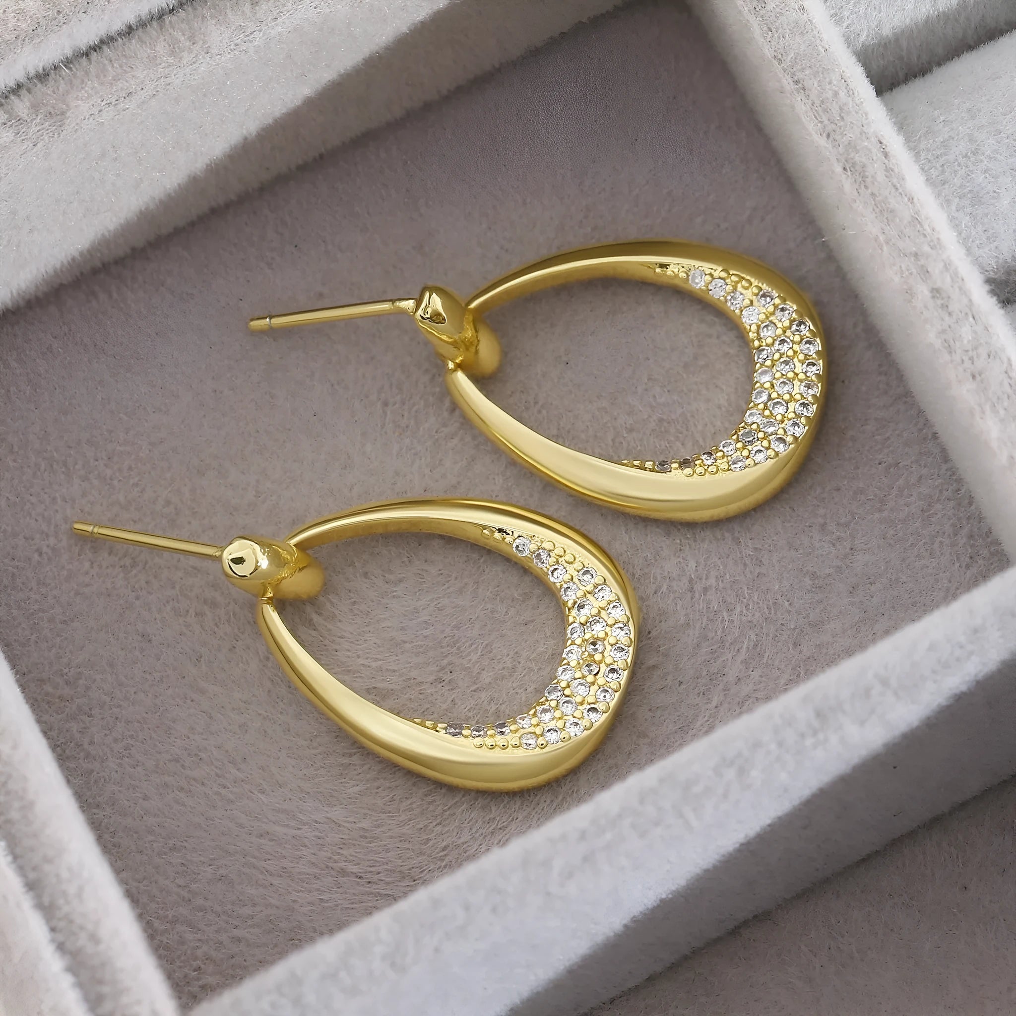 Yellow gold geometric drop earrings for women on a plain background, showing their 2.6 cm length.