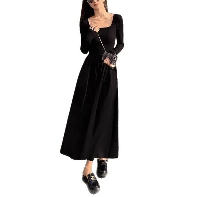 Women's black square collar knitted A-line dress with long sleeves and an elastic waist.