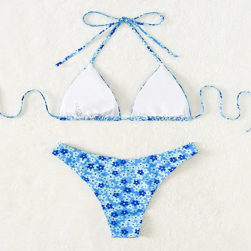 Women's blue printed swimsuit with lace-up front and matching shorts, showing split detail and Asian sizing options