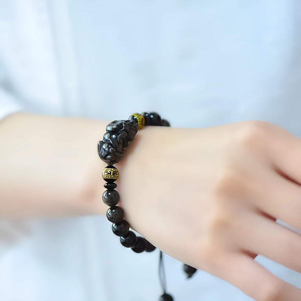 Hand-woven golden obsidian Pi Xiu bracelet with natural stone beads in Chinese zodiac style