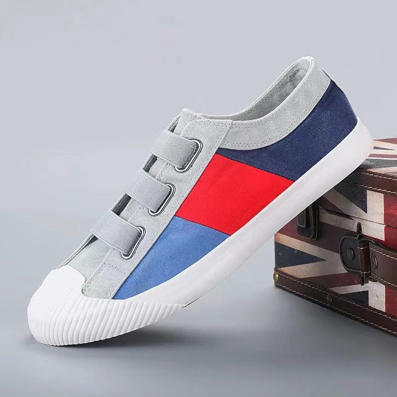 Men's canvas sneakers with rubber sole in multiple colour options showing low top design and elastic band