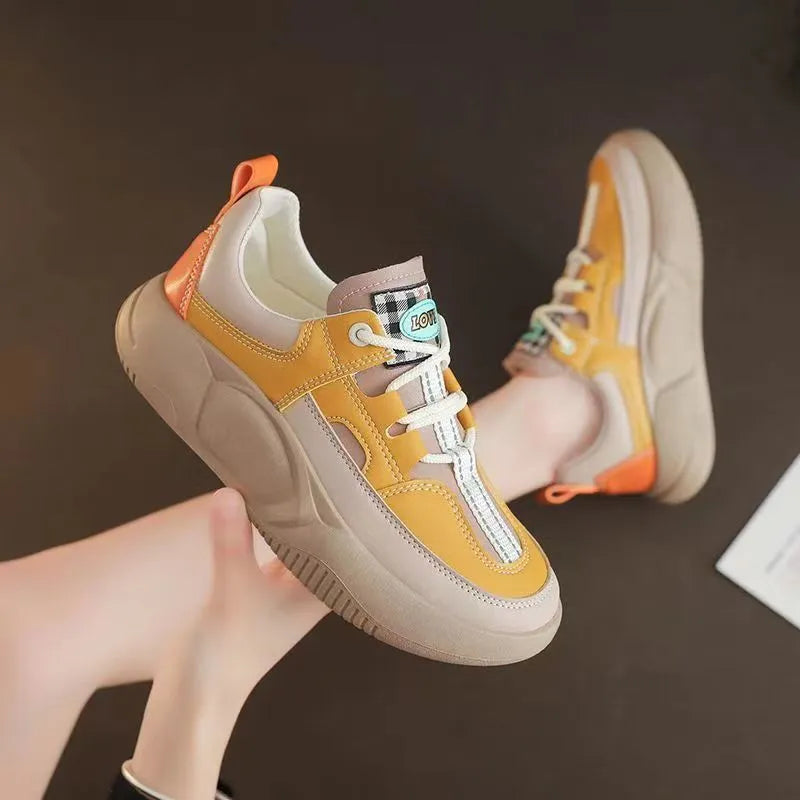 Women's beige thick-soled stitching sneakers with round toe and front lacing on flat heel