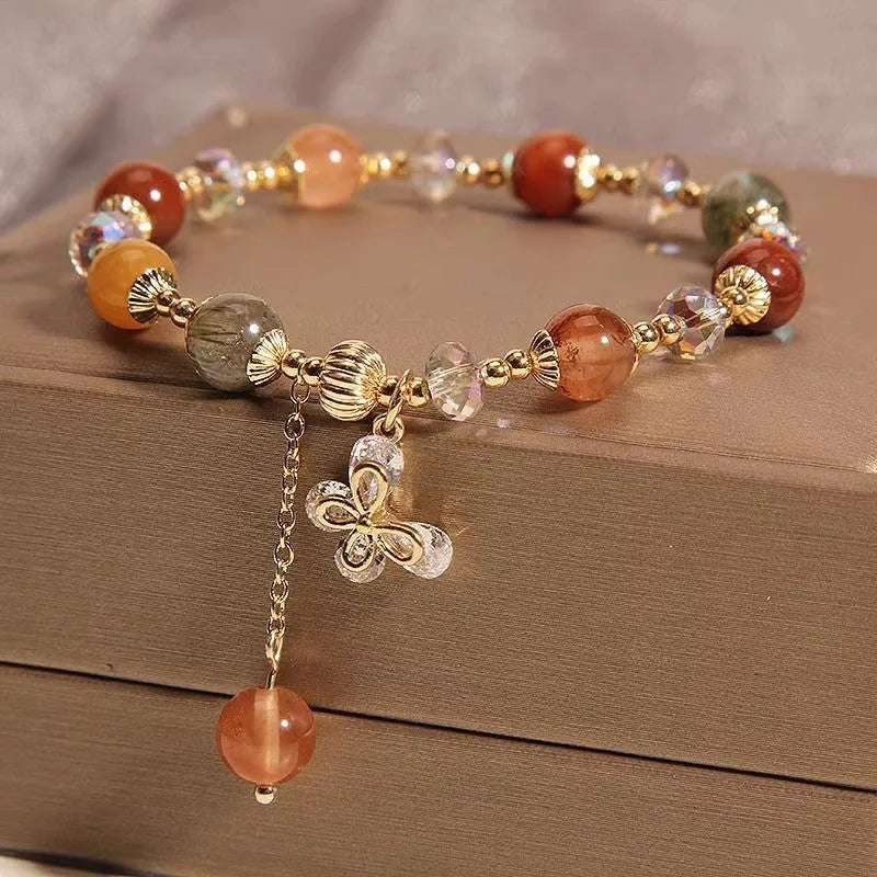 Coloured hair crystal bracelet with single circle design and chosen charm: cat's paw, purse, flower, or zircon butterfly