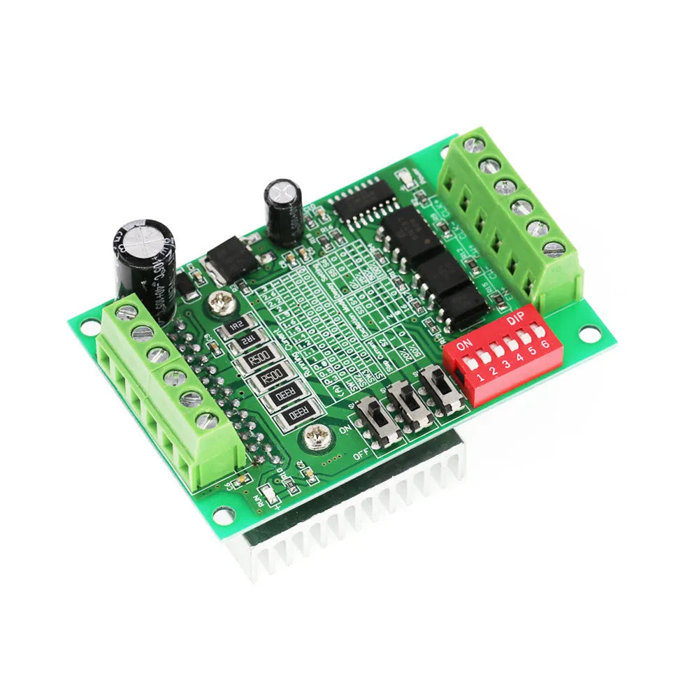 TB6560 stepper motor driver module on a green PCB with aluminium heatsink and screw terminals.