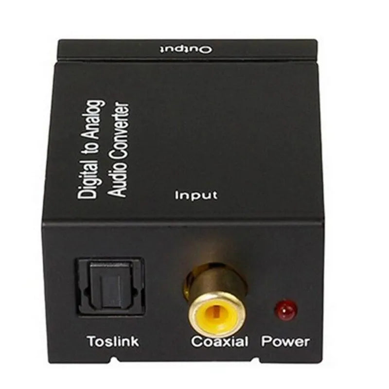 Black digital to analogue audio converter with optical cable and power supply