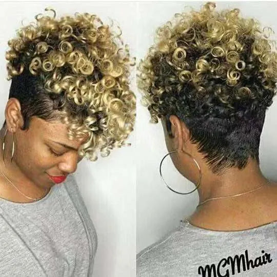 Short black synthetic wig with simple rolled hairstyle, made from Kanekalon fibre.