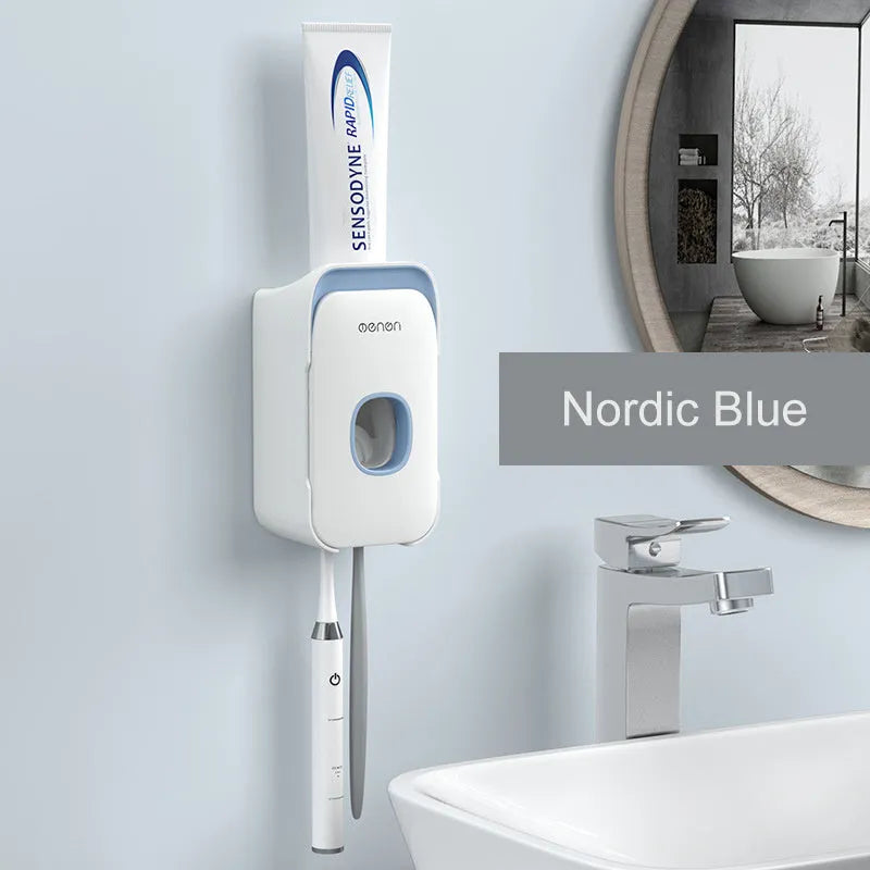 Blue automatic toothpaste dispenser made of ABS plastic mounted on a bathroom wall.