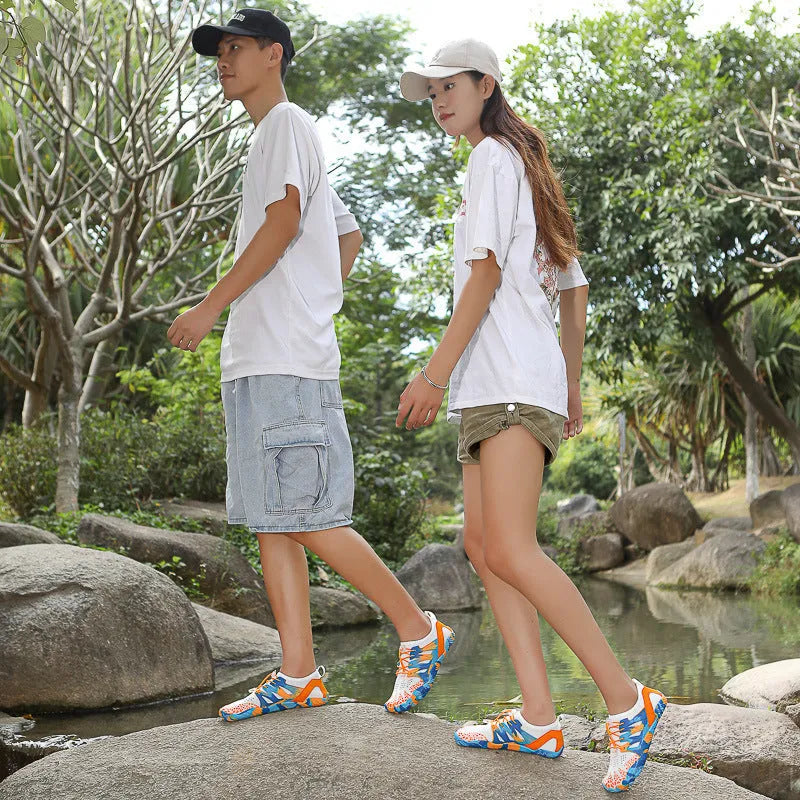 Men's and women's quick-drying lace-up beach wading shoes in various colours on a non-slip rubber sole.