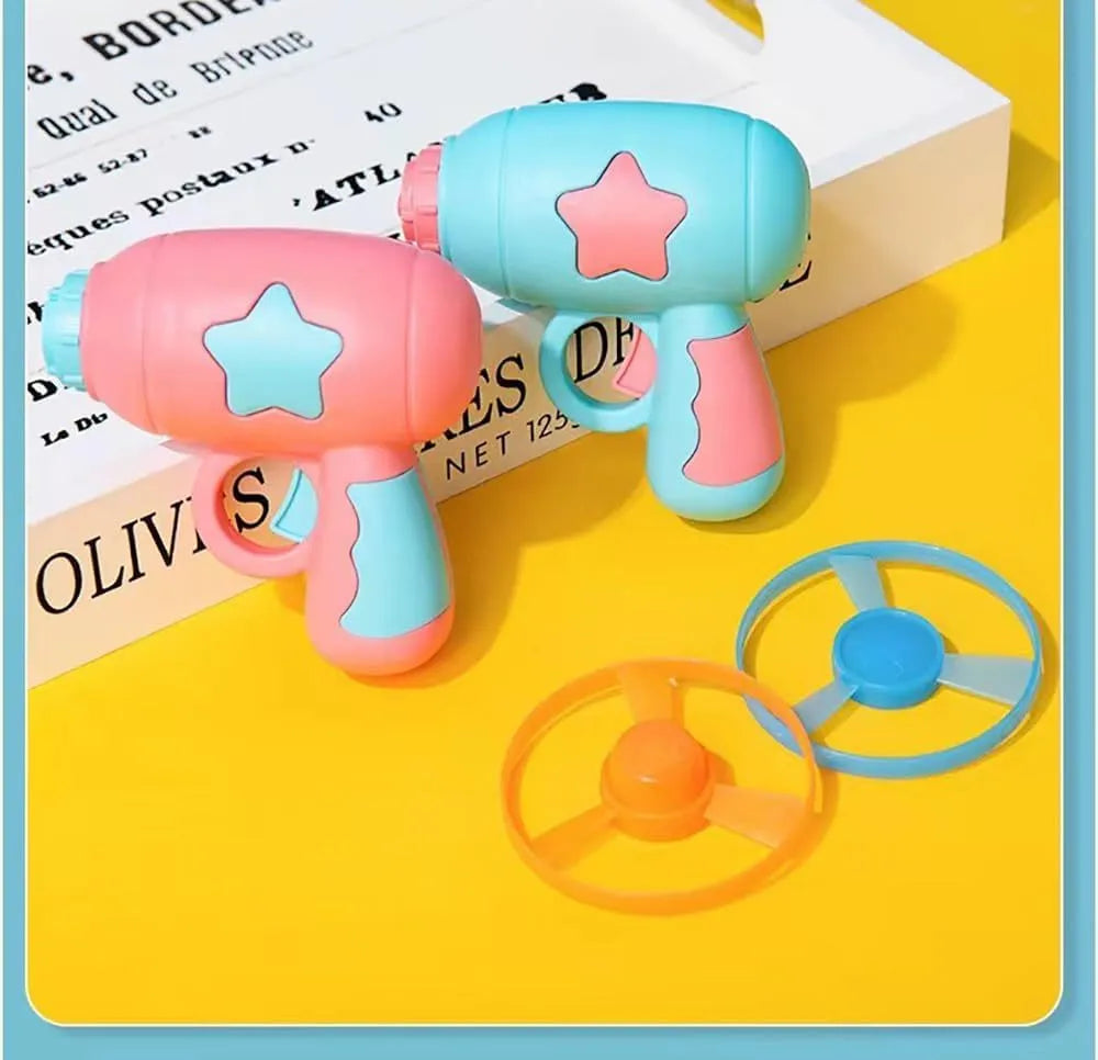 Blue plastic cat toy gun with spinning Frisbee launcher for indoor cats