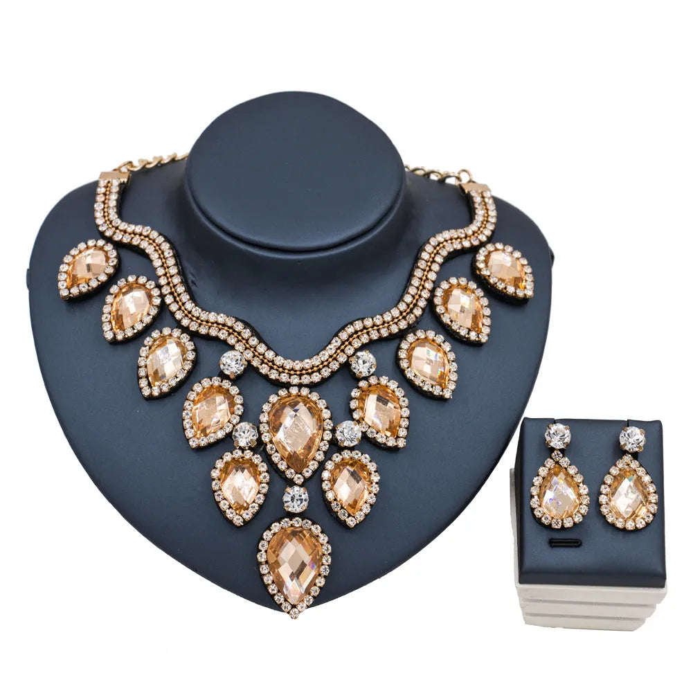 Exaggerated colourful bride necklace and earring set with gold base and colour accents