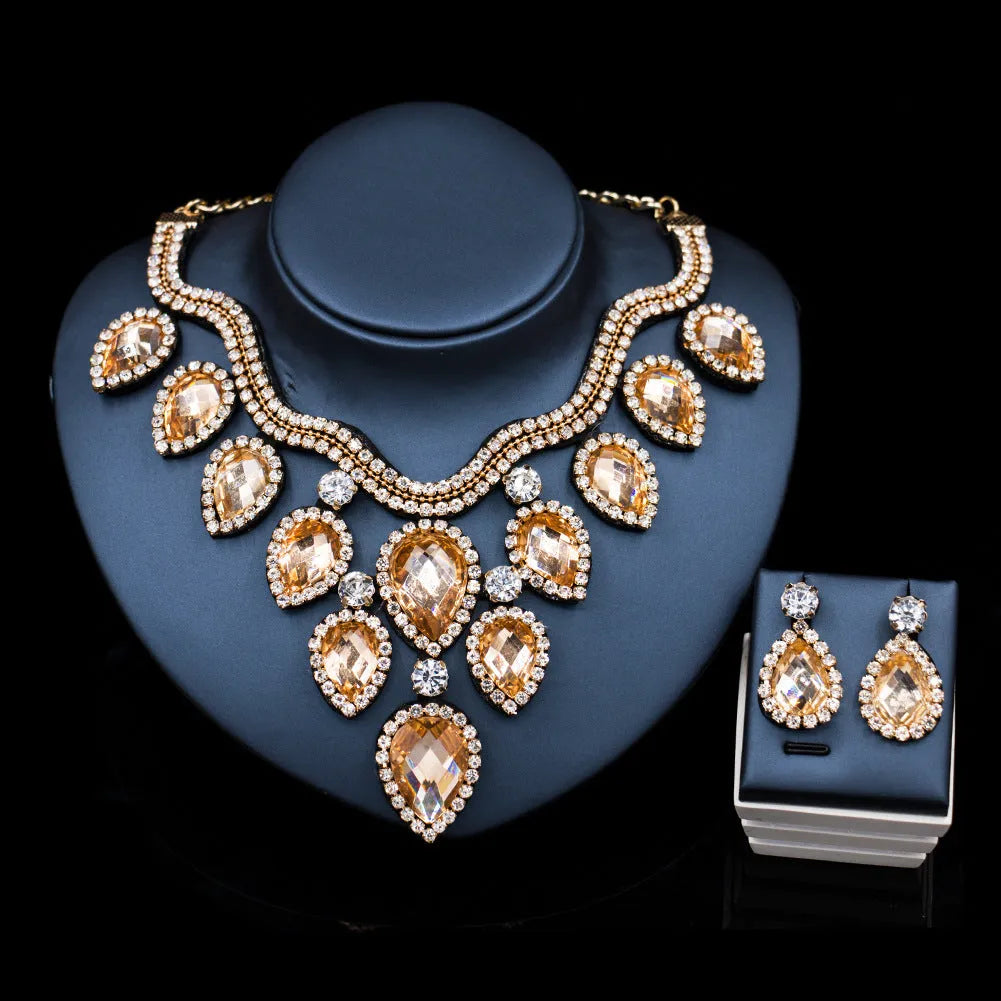Exaggerated colourful bride necklace and earring set with gold base and colour accents