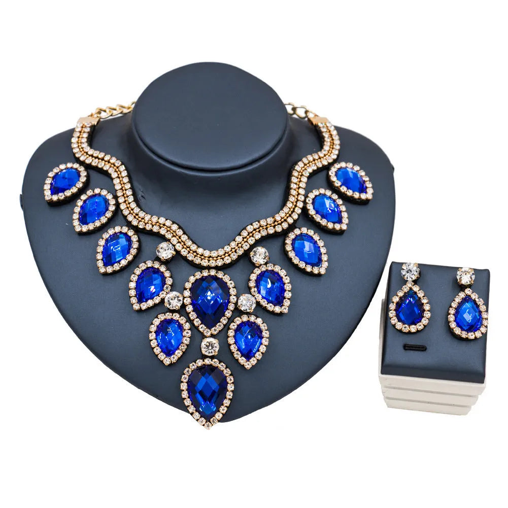 Exaggerated colourful bride necklace and earring set with gold base and colour accents
