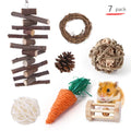 Assortment of natural wooden and woven grass chew toys for small pets like rabbits and guinea pigs