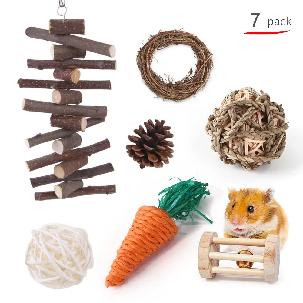 Assortment of natural wooden and woven grass chew toys for small pets like rabbits and guinea pigs