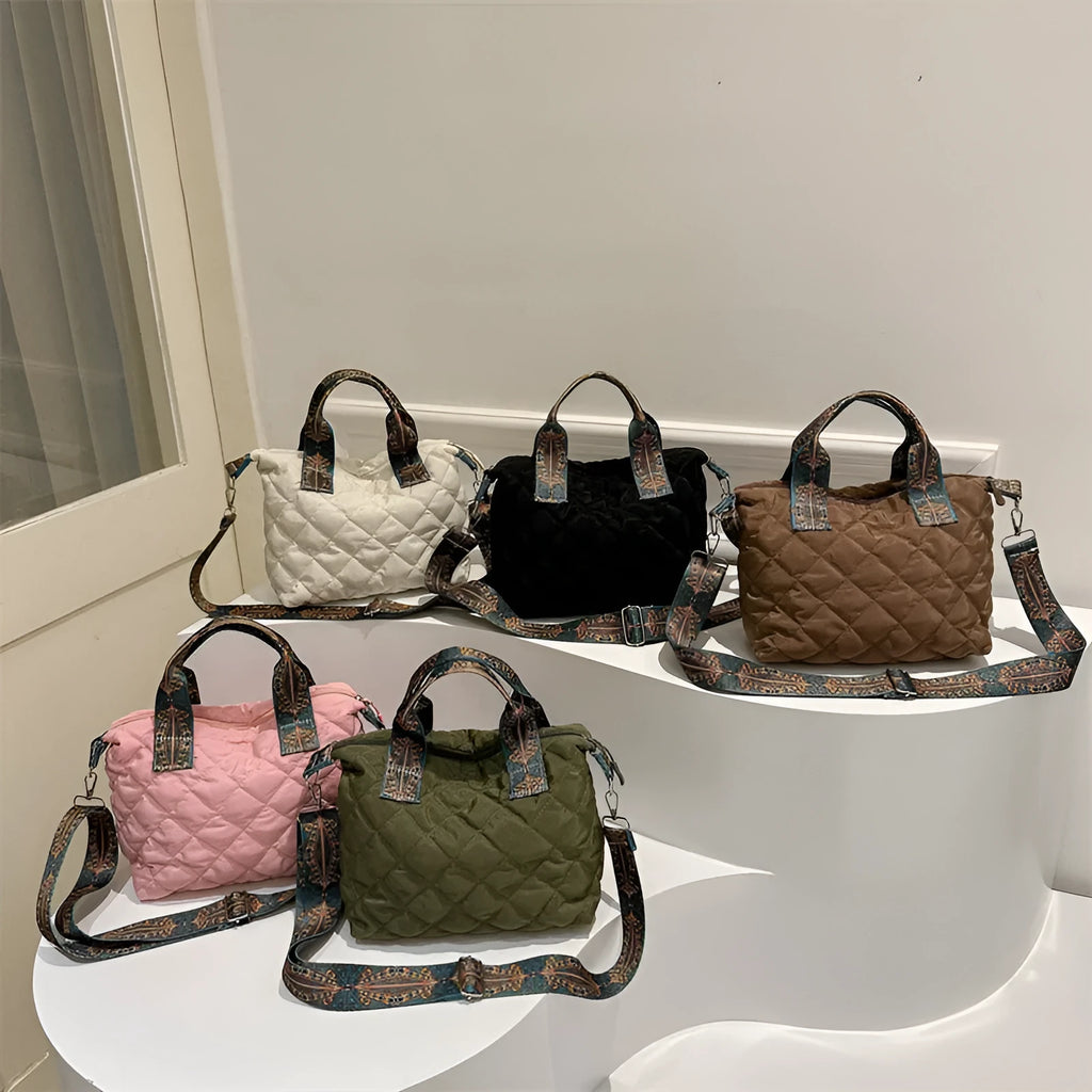 A soft Oxford cloth shoulder messenger bag in a horizontal square shape with embroidery detail.