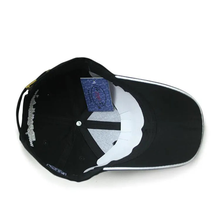Black canvas baseball cap with embroidery and adjustable closure on a neutral background