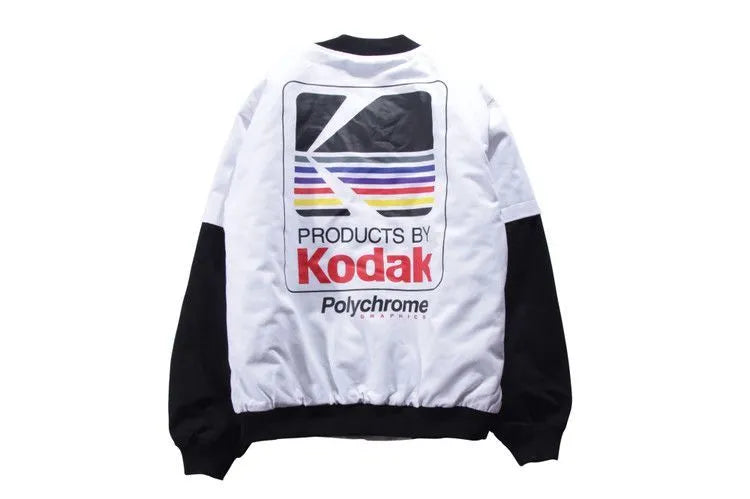 Hip hop style printed baseball jacket in Grey with round neck and side slit pockets on a model