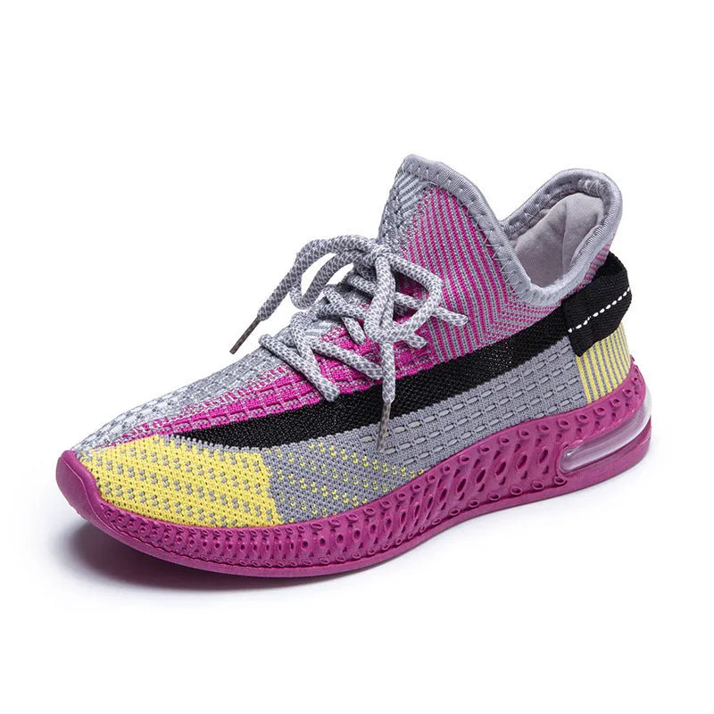 Women's lightweight casual running shoe in purple with front lace-up, round toe, and flat heel.