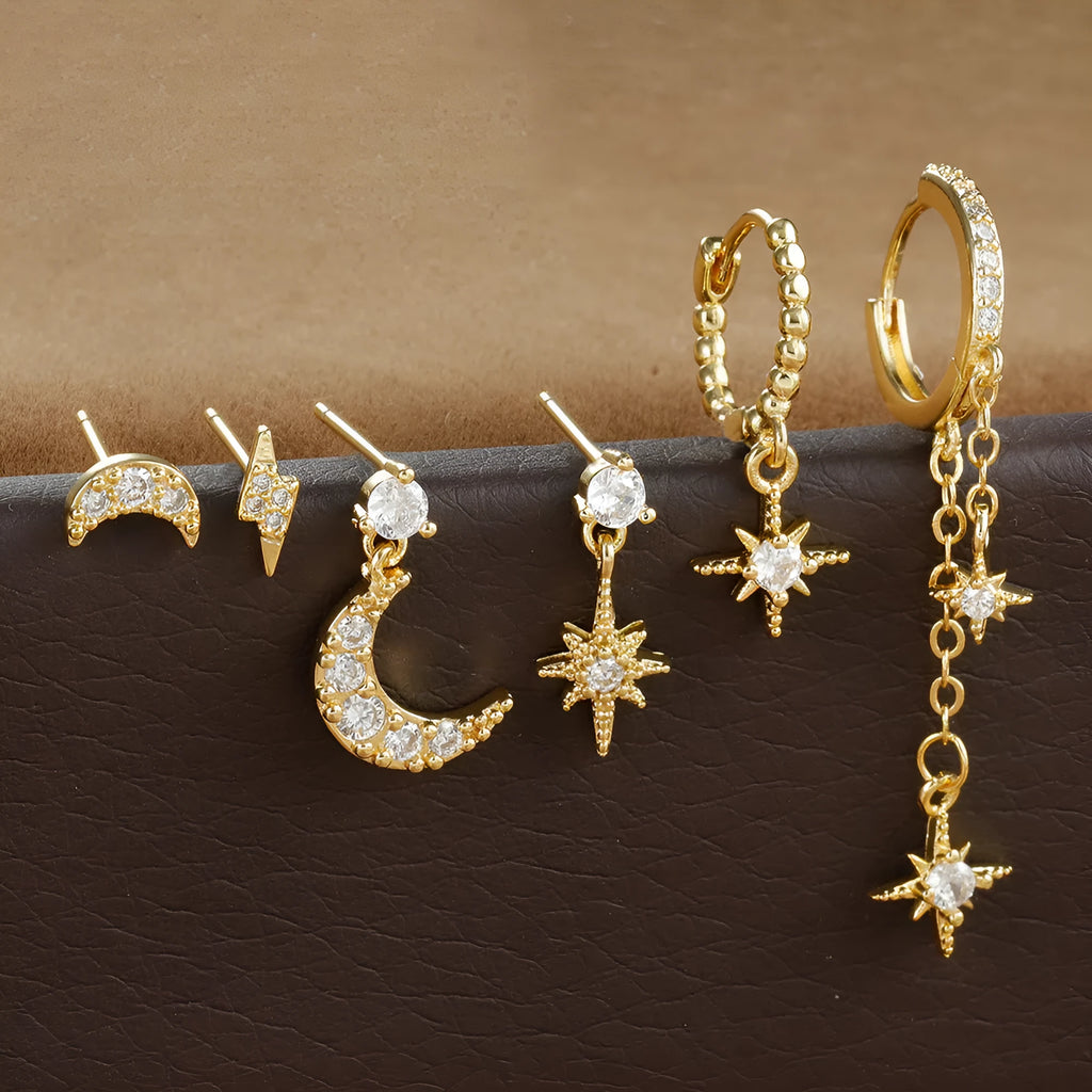 XINGX six-pair gold chain tassel earrings set with zircon studs on jewellery display