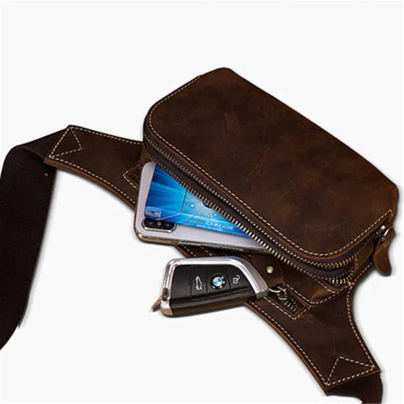 Brown top layer cowhide men's waist bag with pull cord closure, shown with phone compartment open.