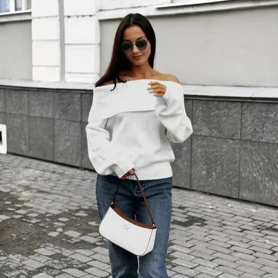Grey off-the-shoulder sweater with a 3D pattern, shown on a model.