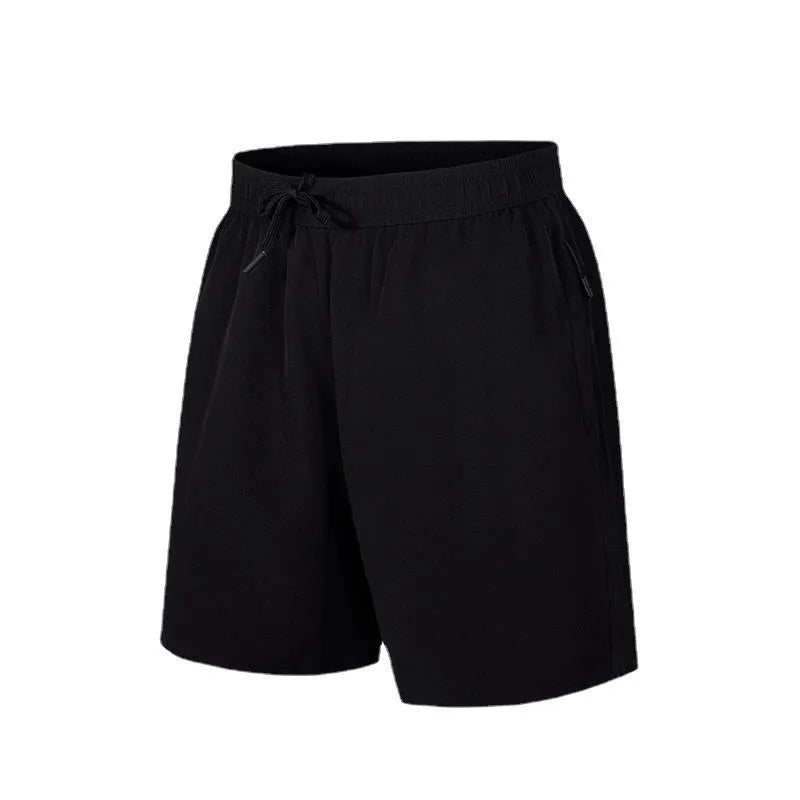 Man wearing loose fit quick-dry polyester beach shorts in a summer colour