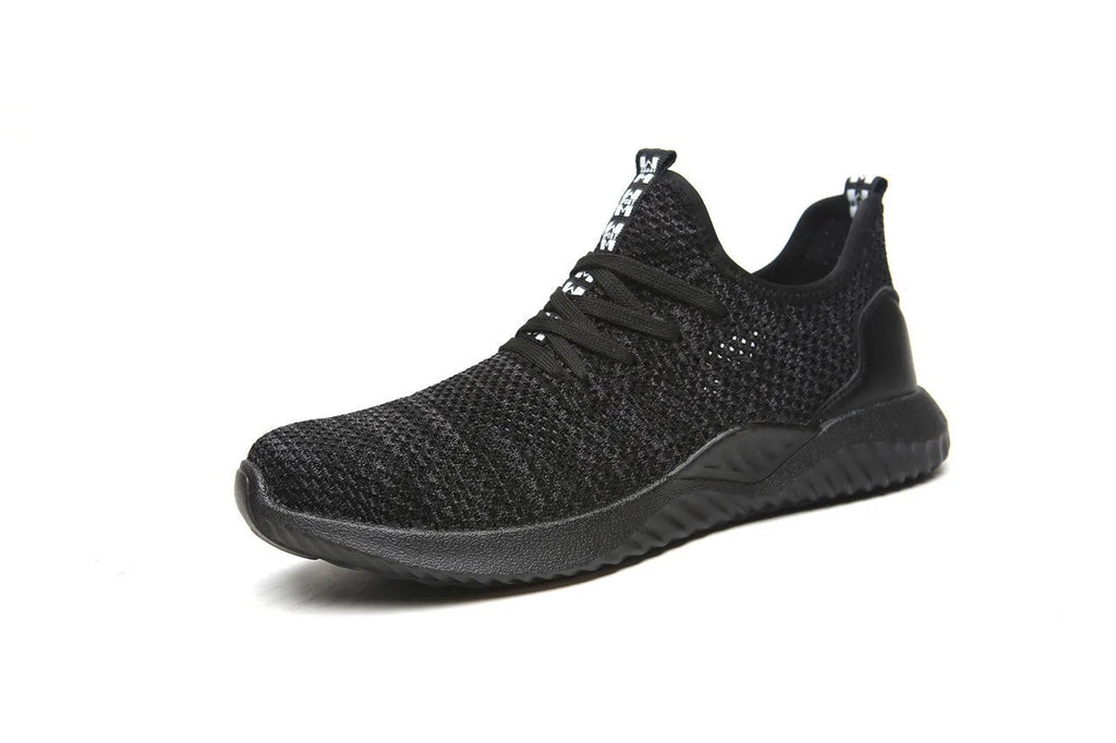 Low-cut black safety work shoes with a steel toe cap on a grey background.