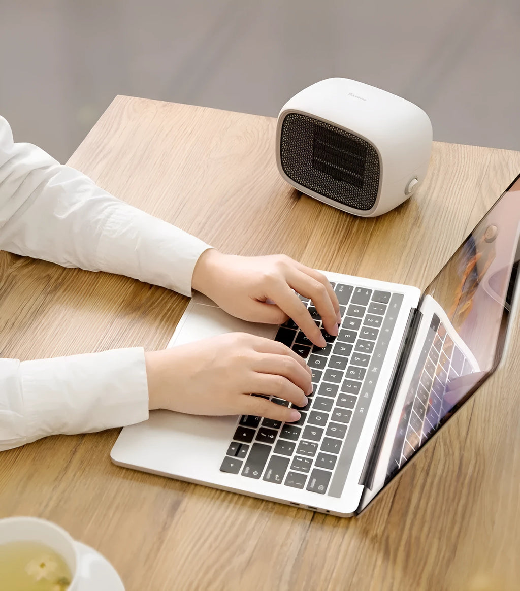 Mini ceramic heater with compact dimensions and green, white, or yellow colour options