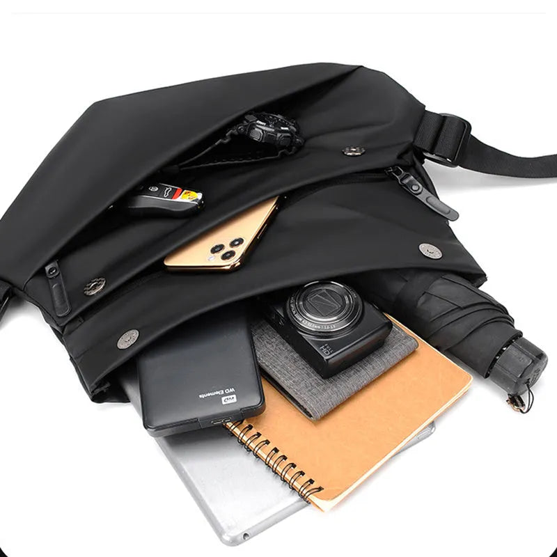 Grey PU leather men's crossbody sling backpack showing front zipper and shoulder strap.