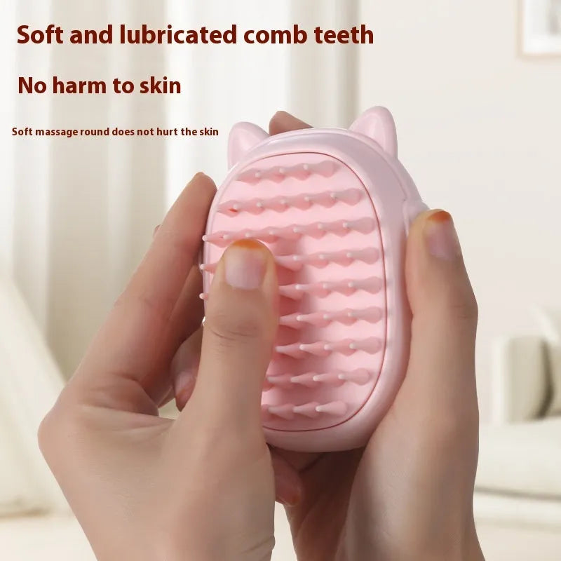 Pink and yellow multifunctional pet comb with built-in laser light for grooming cats and dogs