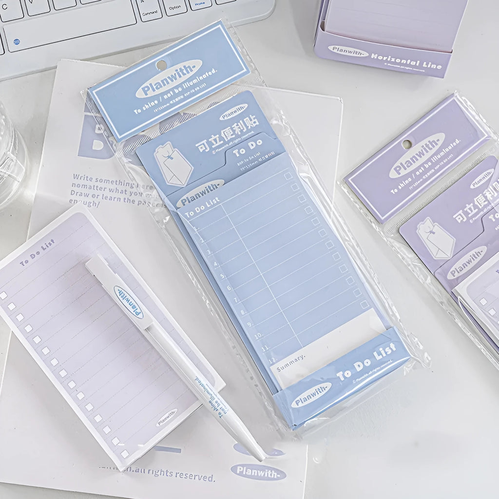 Portable standing Post-it notes in green blank, purple line, blue blank, and gray line colours