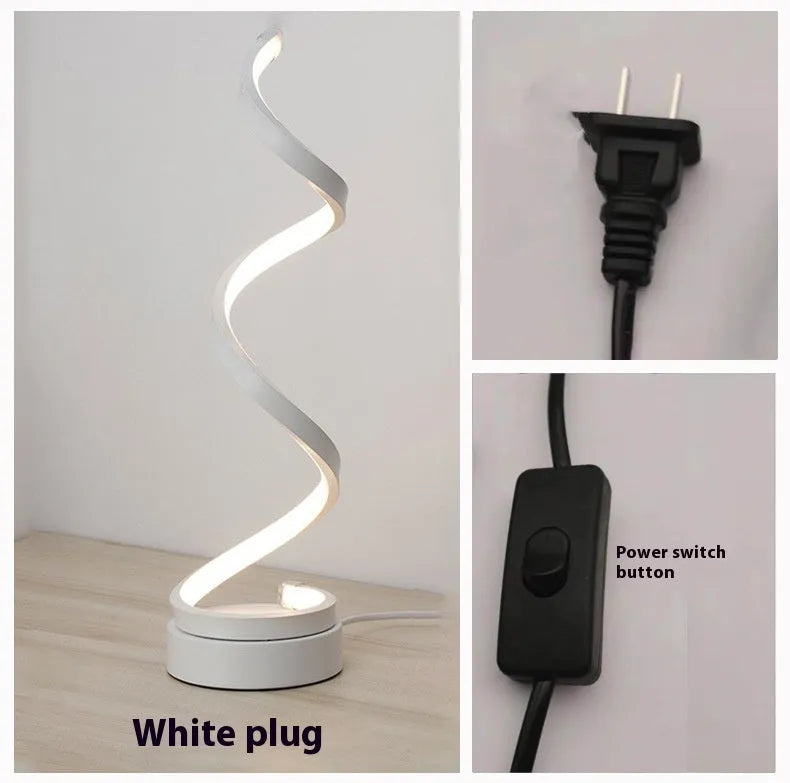 Minimalist black aluminium LED bedside table lamp on nightstand