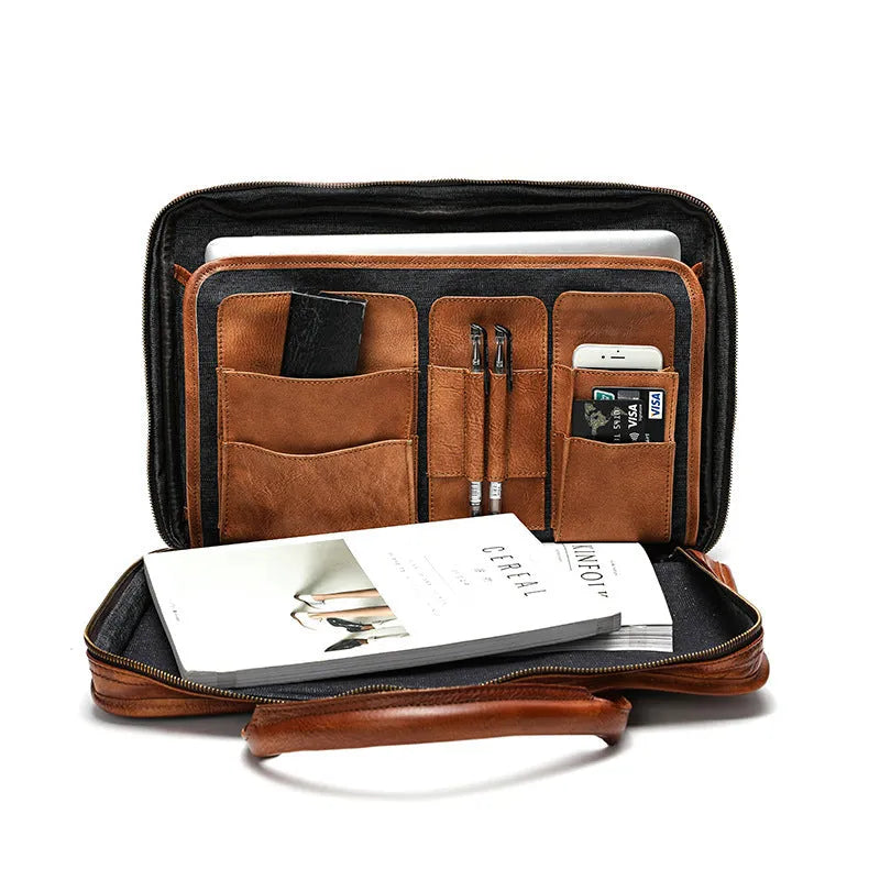 Brown vintage-style leather men's briefcase with open interior showing laptop and organiser pockets.