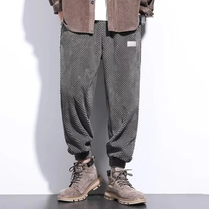 Men's grey ankle-tied casual sport sweatpants with straight leg design on hanger