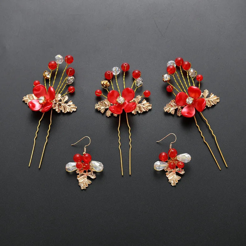 Costume jewellery set with bride headdress and hair ornaments featuring rhinestone and pearl details on gold metal