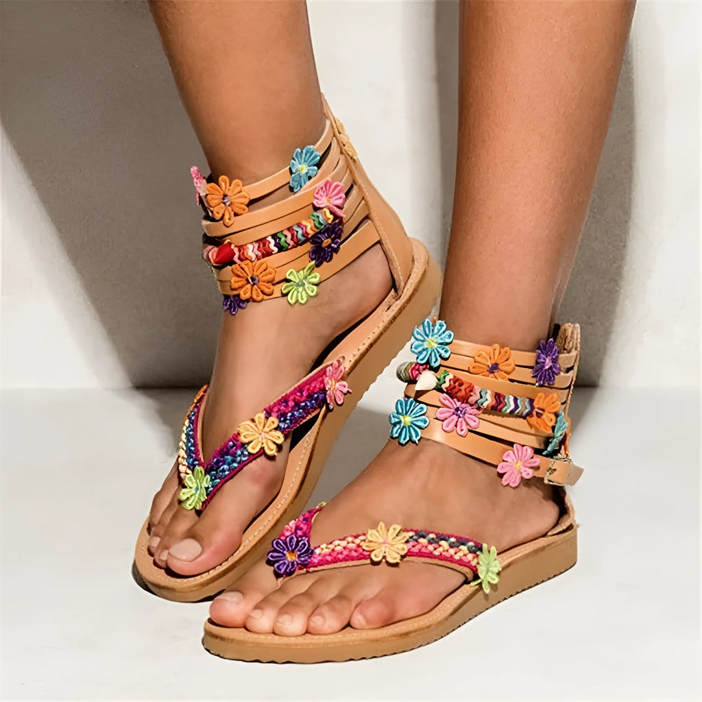 Ethnic beaded petal sandals with floral decoration and round toe.