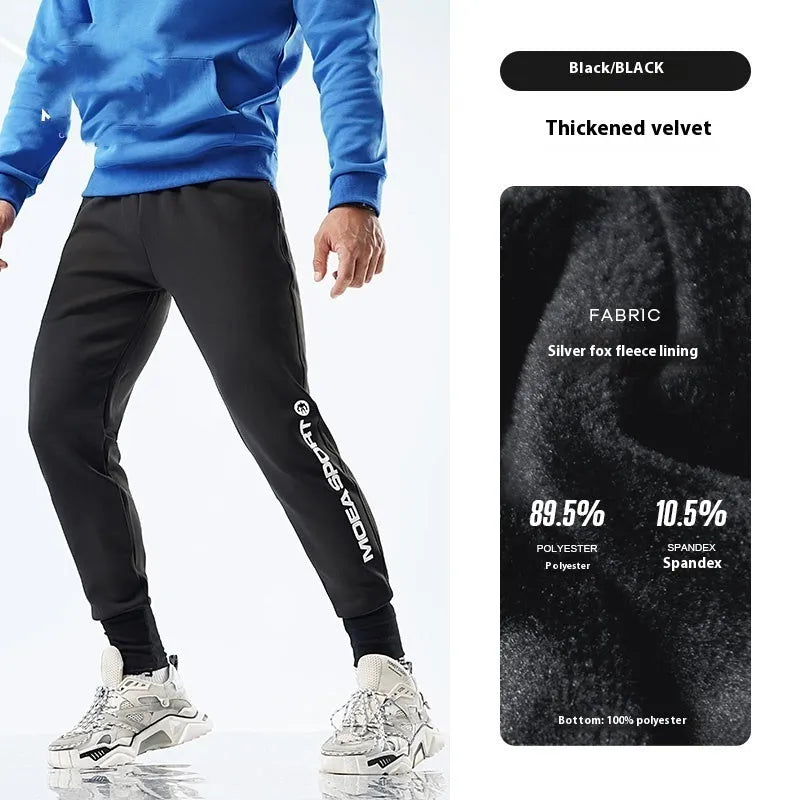 Men's grey blue ankle-tied sweatpants with mid waist, shown on a model.