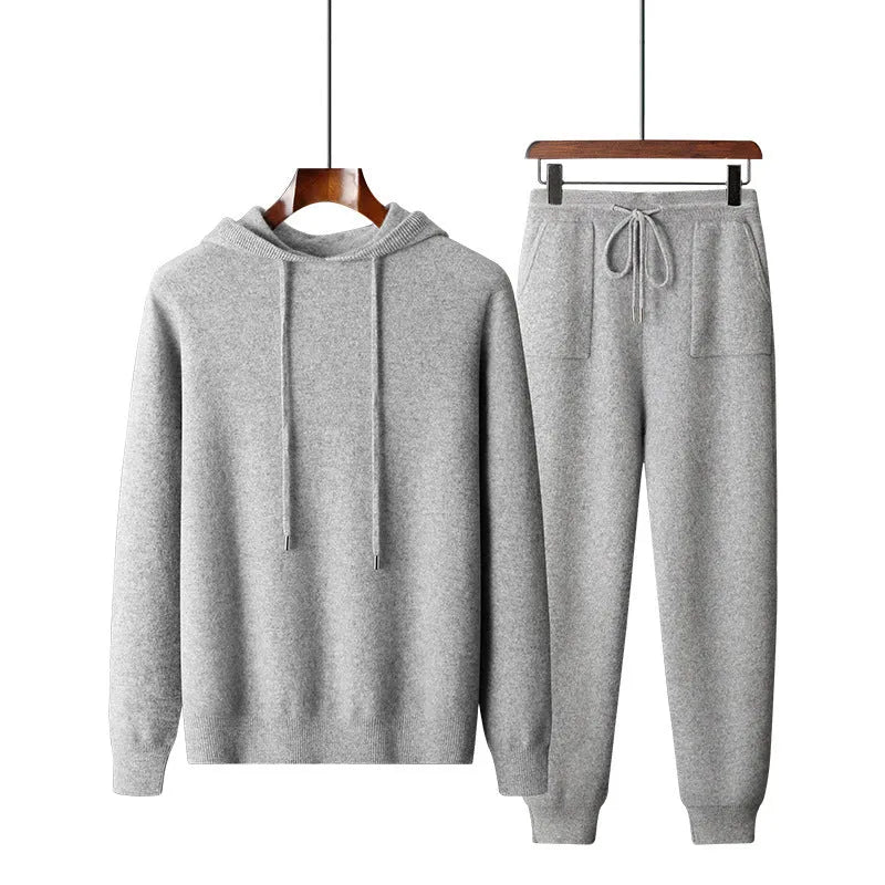 Men's light grey cashmere knitted hoodie and matching long pants casual set laid flat.